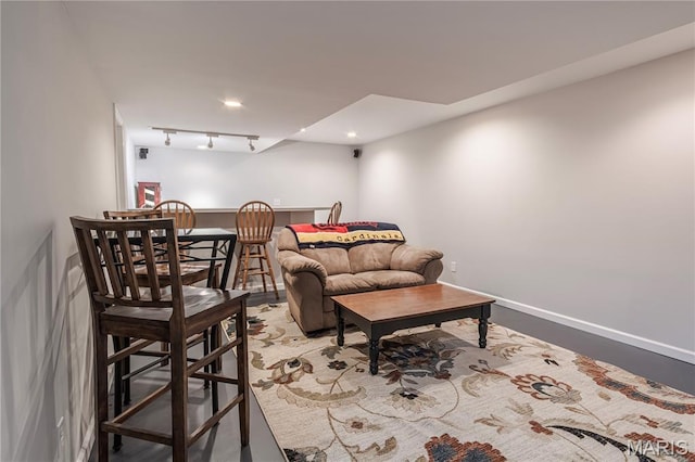 living room with recessed lighting and baseboards