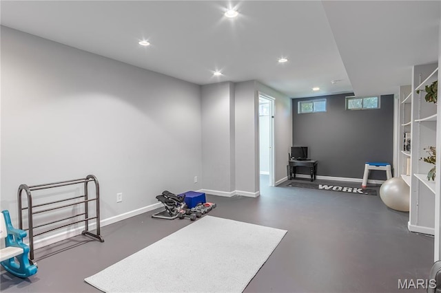 exercise room with baseboards and recessed lighting