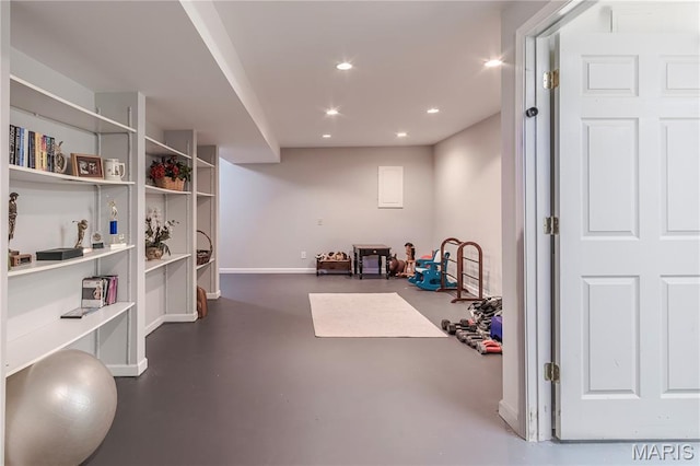 exercise room with recessed lighting and baseboards