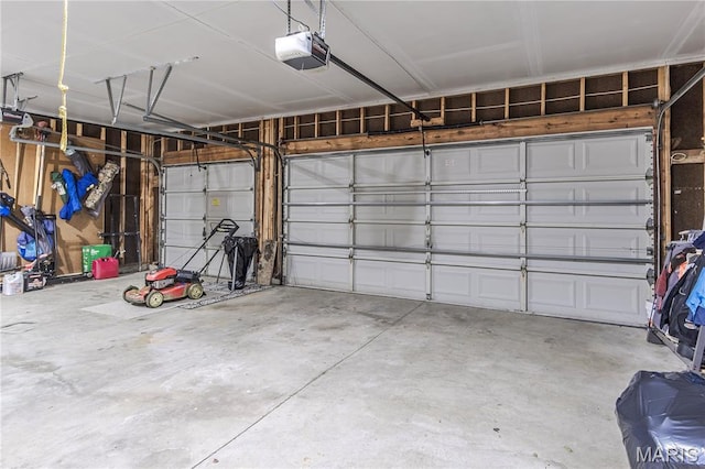 garage featuring a garage door opener