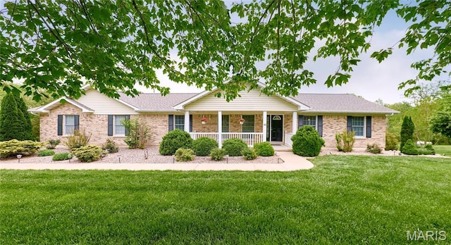 434 Ravenwood Dr, Troy, MO 63379 - ranch-style house featuring covered porch, a front yard, and brick siding