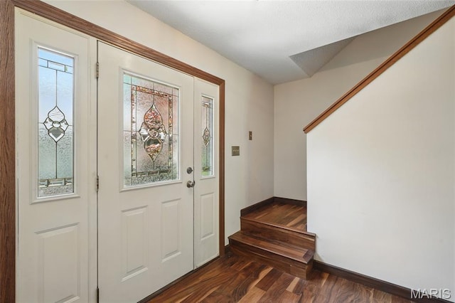 13112 Royal Pines Dr, Saint Louis, MO 63146 - entryway featuring dark wood finished floors, baseboards, and stairs