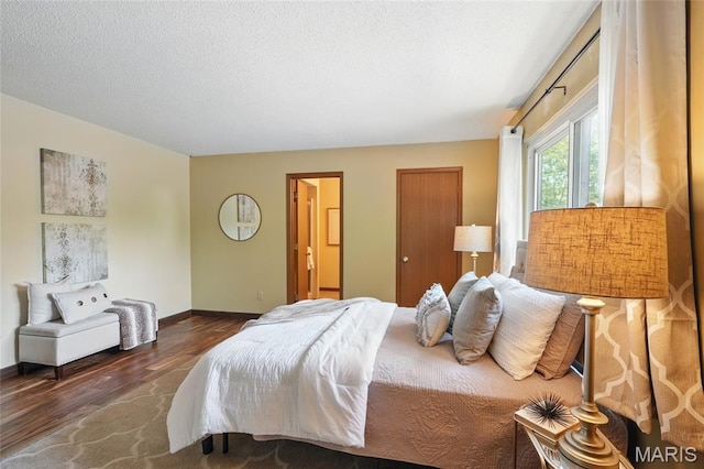 13112 Royal Pines Dr, Saint Louis, MO 63146 - bedroom with wood finished floors, baseboards, and a textured ceiling