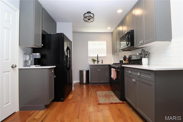 424 Shellview St, Bethalto, IL 62010 - kitchen with black appliances, gray cabinets, light wood-style flooring, backsplash, and recessed lighting