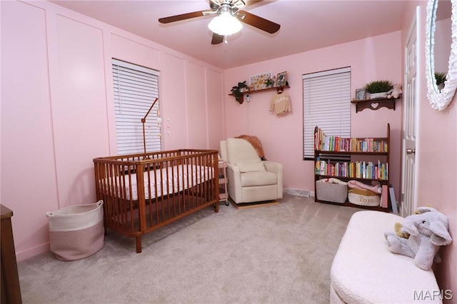 424 Shellview St, Bethalto, IL 62010 - carpeted bedroom featuring a nursery area, a ceiling fan, and baseboards