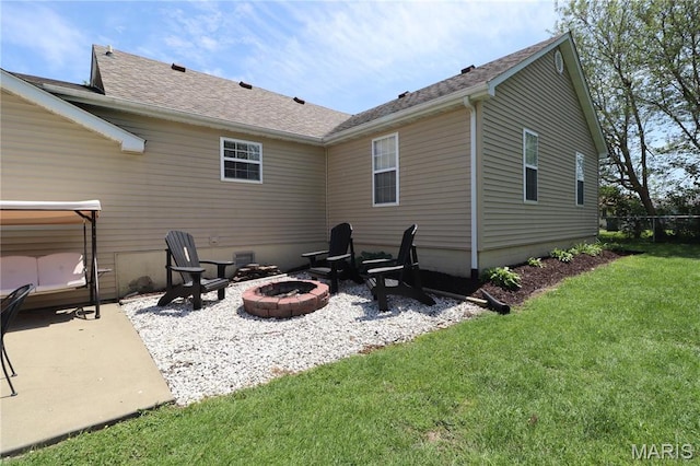 424 Shellview St, Bethalto, IL 62010 - back of house featuring a fire pit, a yard, a patio, and roof with shingles