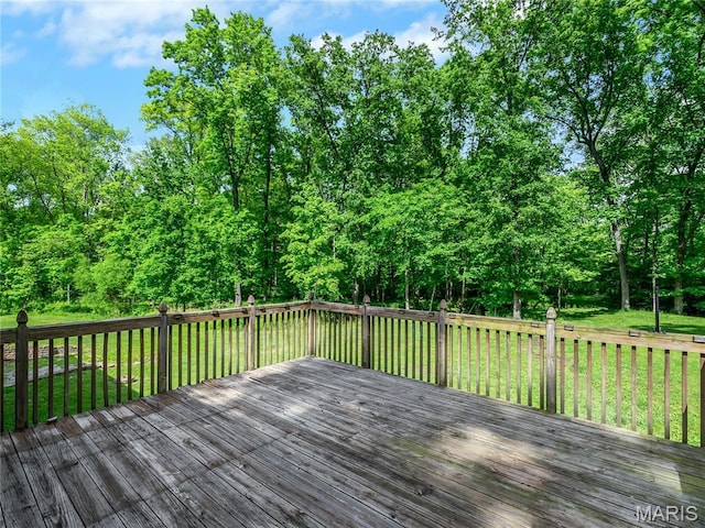 wooden terrace with a yard