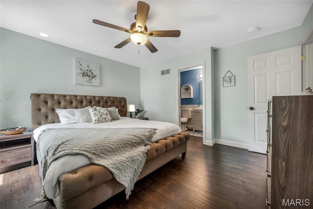 7302 Macleod Ln, Ofallon, MO 63368 - bedroom featuring dark wood-style floors, baseboards, ceiling fan, and ensuite bath