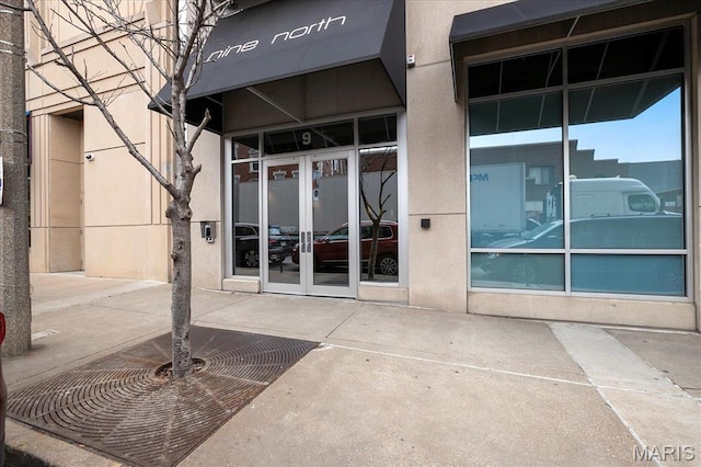 9 N Euclid Ave Unit 411, Saint Louis, MO 63108 - view of exterior entry with french doors and stucco siding
