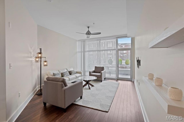 9 N Euclid Ave Unit 411, Saint Louis, MO 63108 - living area featuring hardwood / wood-style flooring, floor to ceiling windows, ceiling fan, and baseboards