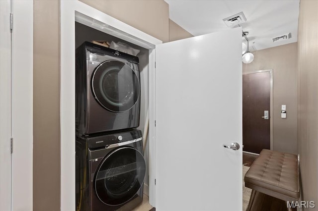 9 N Euclid Ave Unit 411, Saint Louis, MO 63108 - clothes washing area featuring estacked washer and dryer