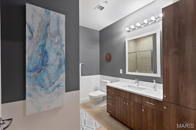 9 N Euclid Ave Unit 411, Saint Louis, MO 63108 - bathroom with toilet, tile patterned flooring, a shower, and vanity