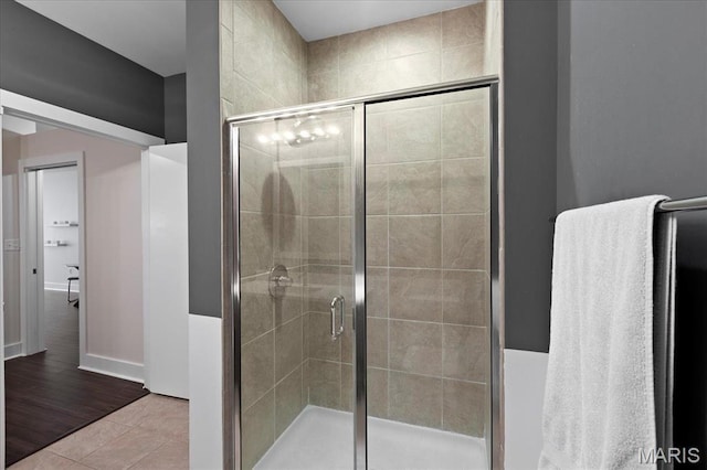 9 N Euclid Ave Unit 411, Saint Louis, MO 63108 - bathroom with a stall shower, baseboards, and tile patterned floors