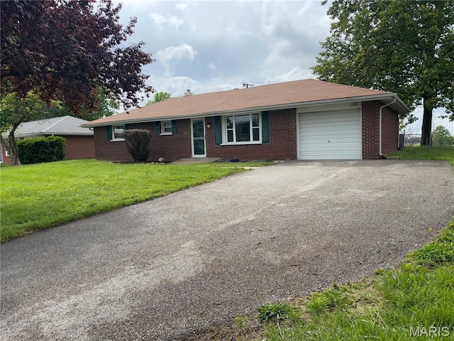 7208 Montclair, Godfrey, IL 62035 - ranch-style house with a garage, brick siding, driveway, and a front yard