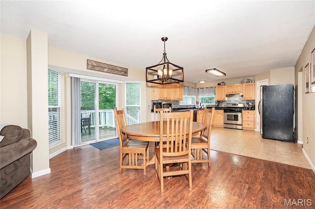 1408 Glacier Pass, Festus, MO 63028 - dining room with a chandelier, light wood-style floors, and baseboards