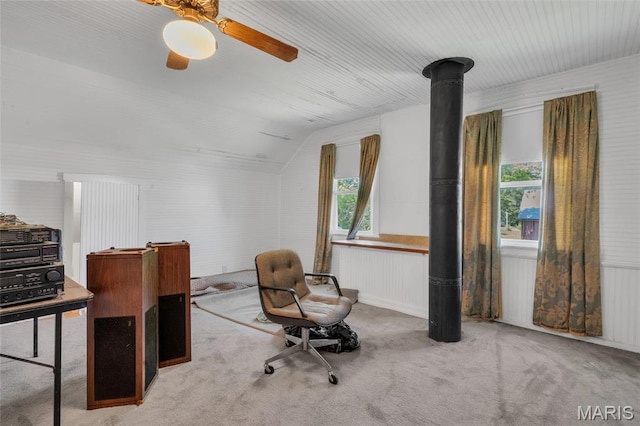 carpeted office space with lofted ceiling and a ceiling fan