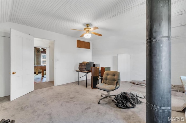 sitting room with ceiling fan, carpet, and an office area