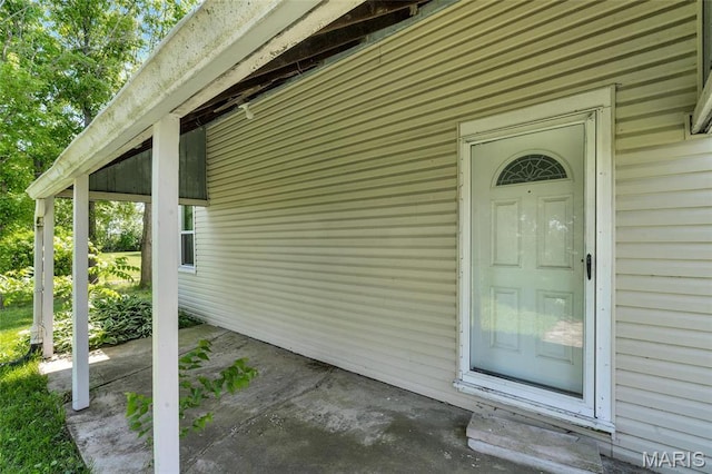 doorway to property with a patio area
