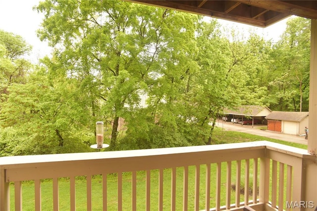 wooden terrace featuring a detached garage