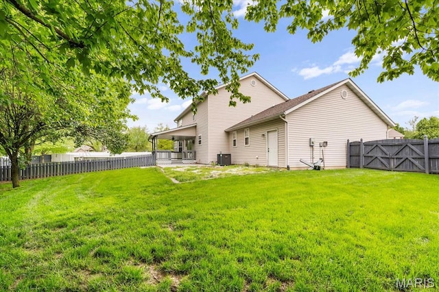 back of house featuring central AC unit