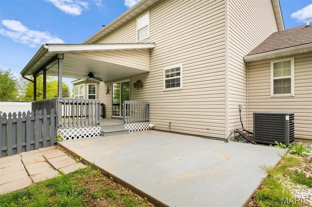 view of patio / terrace with a ceiling fan, central AC unit, and fence