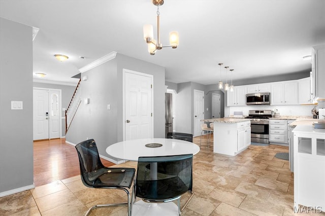 dining area featuring a chandelier, baseboards, crown molding, and stairs
