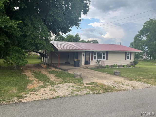 206 E Spring St, Doniphan, MO 63935 - view of front of property featuring concrete driveway, a carport, a front lawn, a porch, and a metal roof