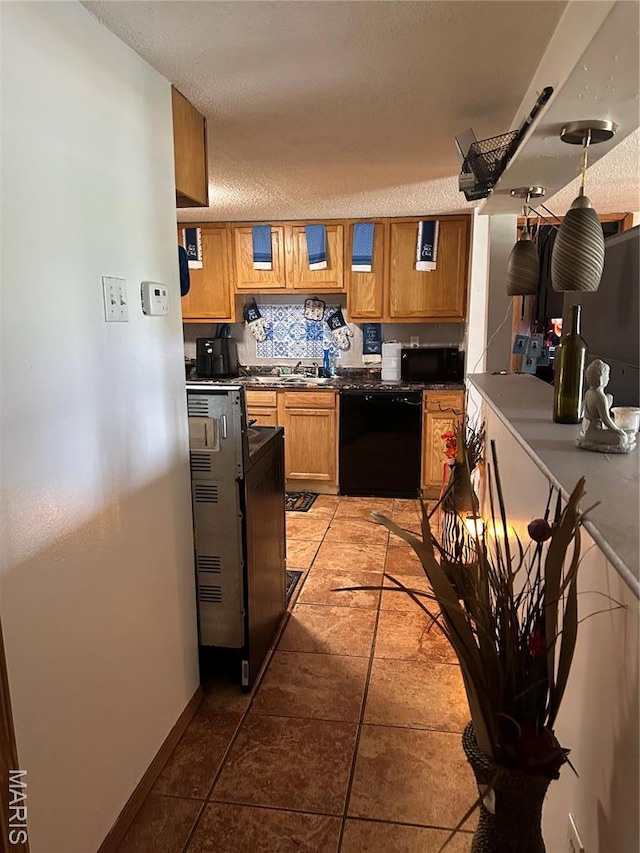 514 N 48th St E, St Louis, IL 62205 - kitchen with dishwasher, brown cabinets, black microwave, dark countertops, and a textured ceiling
