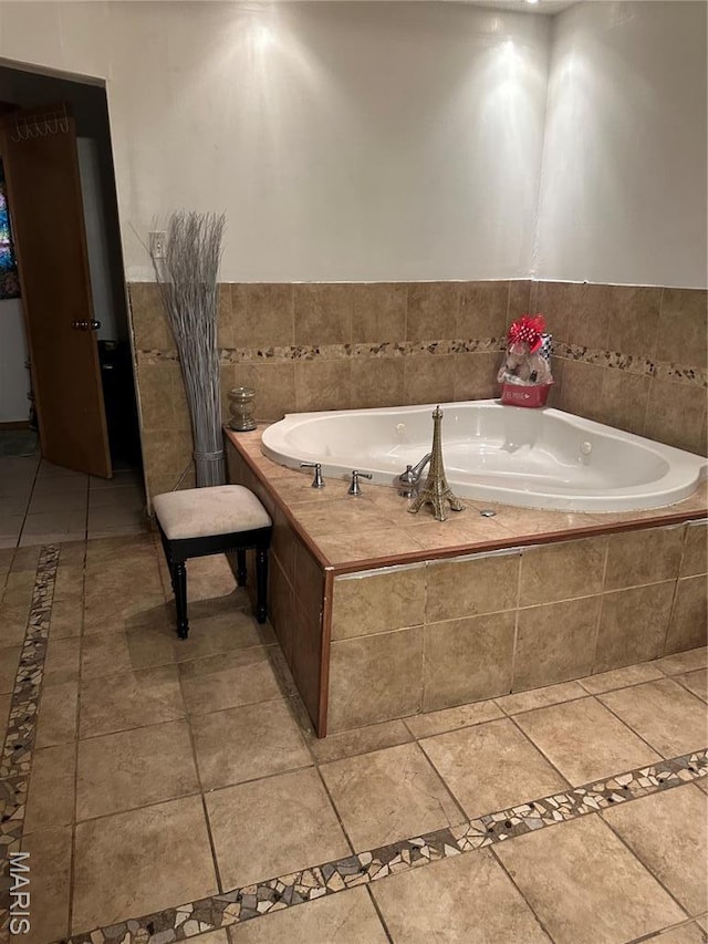 514 N 48th St E, St Louis, IL 62205 - bathroom featuring a bath, inlaid floor details, and tile patterned floors