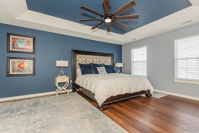346 Palisades Ridge Ct, Eureka, MO 63025 - bedroom with a raised ceiling, baseboards, wood finished floors, and ceiling fan
