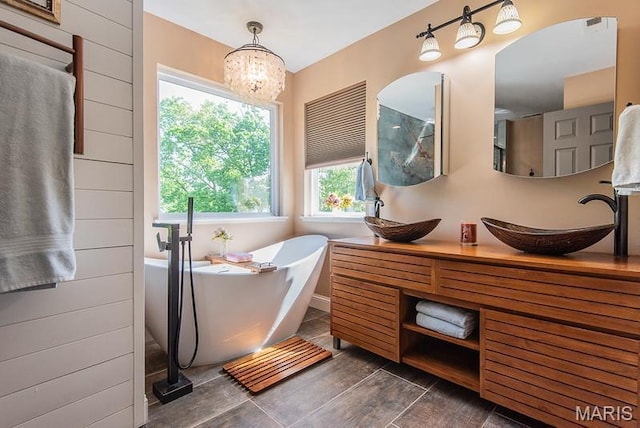 346 Palisades Ridge Ct, Eureka, MO 63025 - bathroom featuring a freestanding bath, vanity, and a chandelier