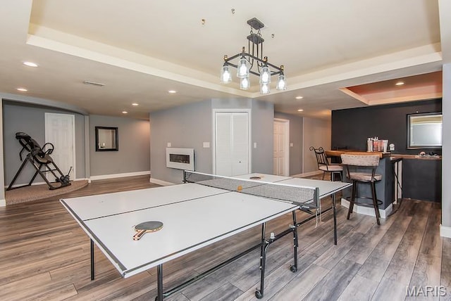 346 Palisades Ridge Ct, Eureka, MO 63025 - recreation room featuring a tray ceiling, wood finished floors, recessed lighting, and baseboards