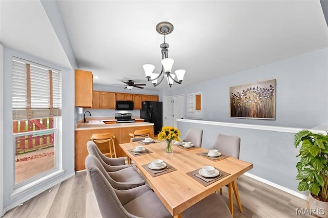 1102 Danielle Elizabeth Ct, Ofallon, MO 63366 - dining area featuring a chandelier and light wood finished floors
