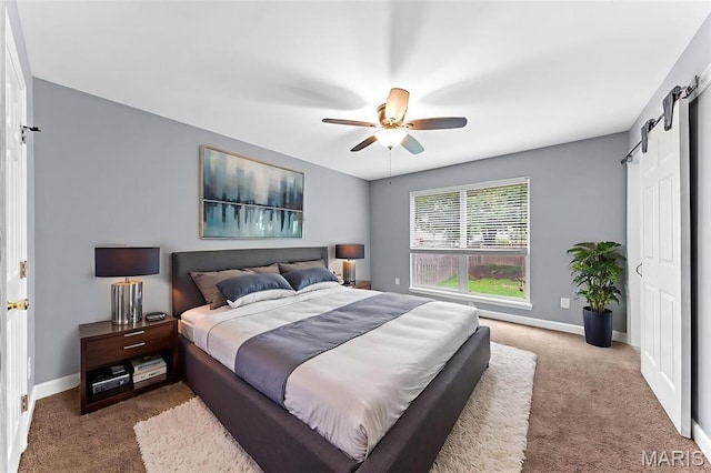 1102 Danielle Elizabeth Ct, Ofallon, MO 63366 - bedroom featuring carpet floors, a ceiling fan, and a barn door