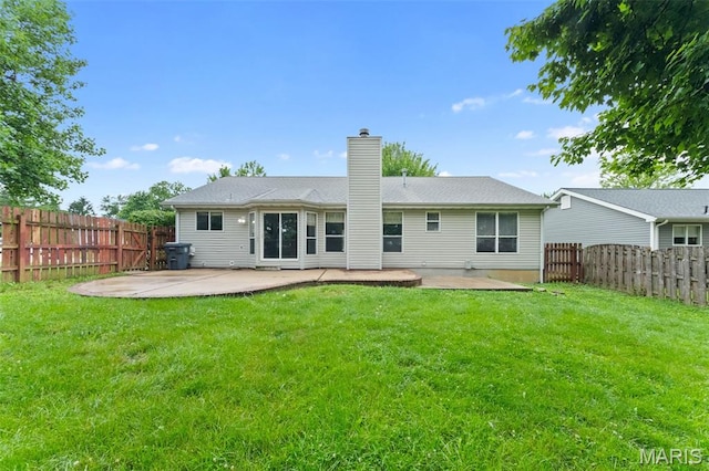 1102 Danielle Elizabeth Ct, Ofallon, MO 63366 - back of property with a patio, a chimney, and a fenced backyard
