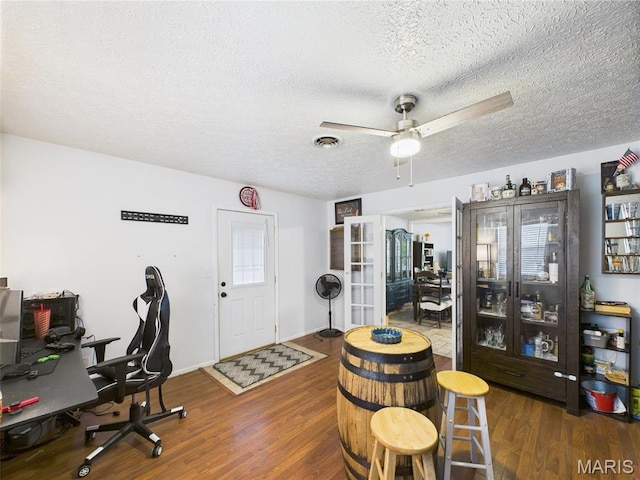 14469 Tailor Rd, Saint Robert, MO 65584 - home office featuring a textured ceiling, wood finished floors, ceiling fan, and french doors