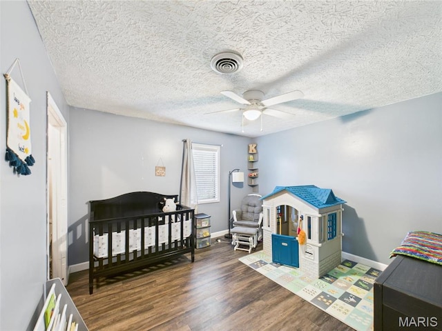 14469 Tailor Rd, Saint Robert, MO 65584 - bedroom with wood finished floors, baseboards, and a ceiling fan