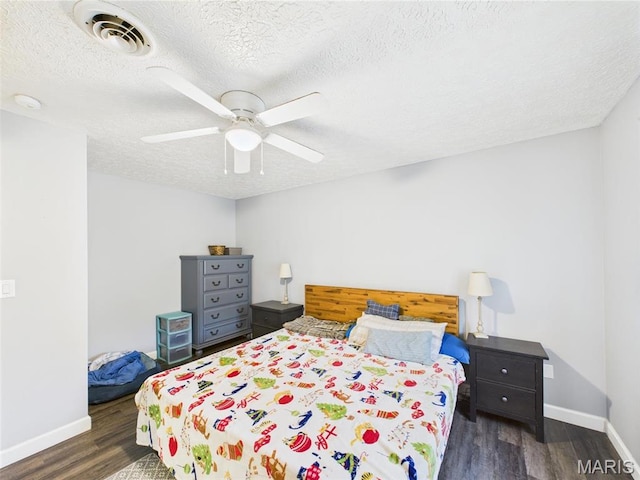 14469 Tailor Rd, Saint Robert, MO 65584 - bedroom featuring wood finished floors, baseboards, ceiling fan, and a textured ceiling
