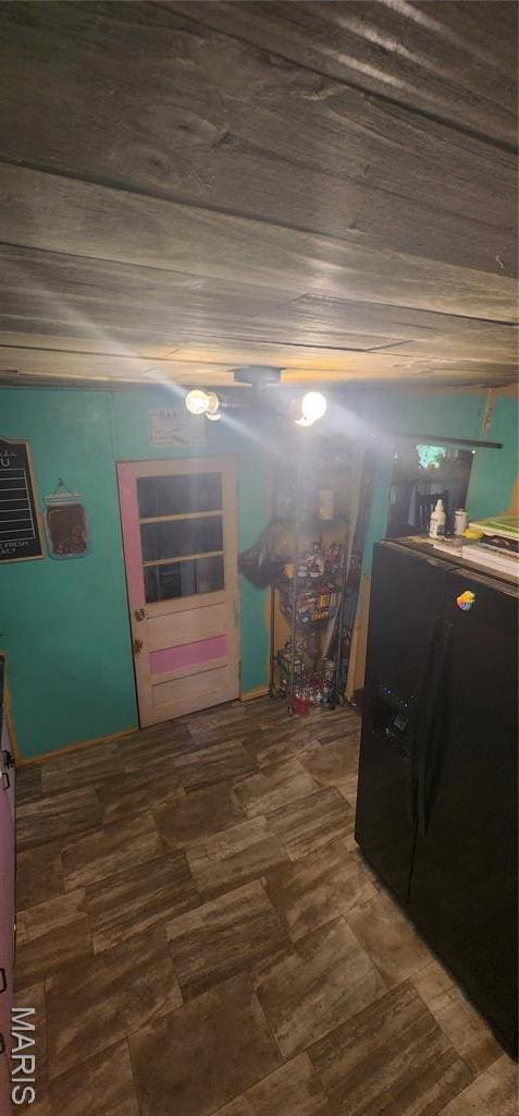 bedroom featuring black fridge