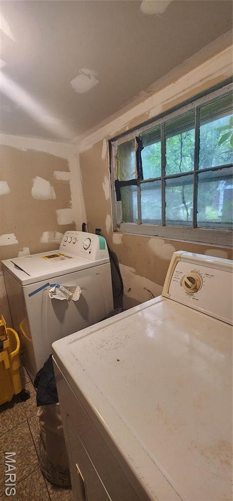 washroom with independent washer and dryer