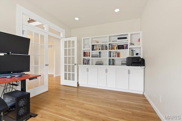 1417 Red Oak Plantation Dr, Ballwin, MO 63021 - office with french doors, light wood finished floors, and baseboards