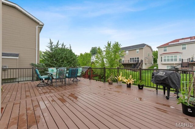 1417 Red Oak Plantation Dr, Ballwin, MO 63021 - wooden terrace featuring outdoor dining space, a residential view, and a grill