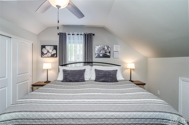 bedroom featuring vaulted ceiling, a ceiling fan, and a closet