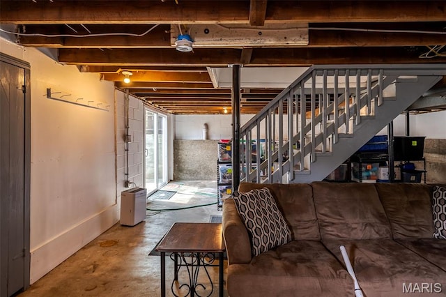 unfinished below grade area featuring stairway