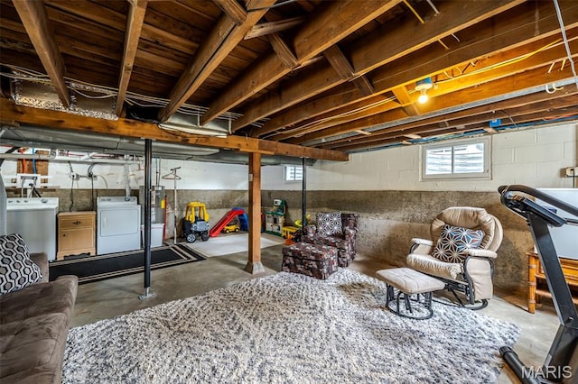 basement featuring washing machine and clothes dryer