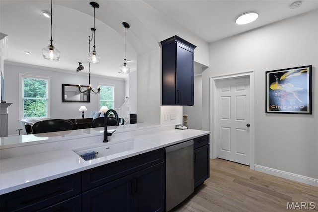 1606 Mississippi Ave, Saint Louis, MO 63104 - kitchen with stainless steel dishwasher, a sink, light countertops, light wood-type flooring, and hanging light fixtures