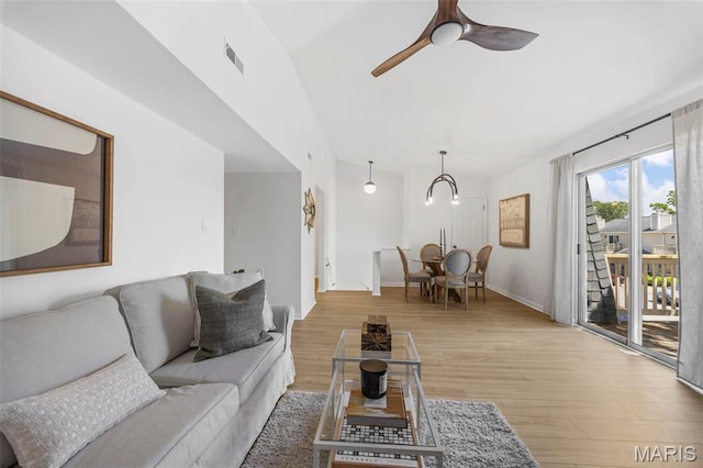 8917 Cardinal Ter, Saint Louis, MO 63144 - living room featuring wood finished floors, ceiling fan, and baseboards