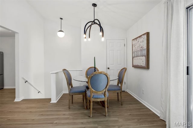 8917 Cardinal Ter, Saint Louis, MO 63144 - dining space featuring wood finished floors, lofted ceiling, and baseboards
