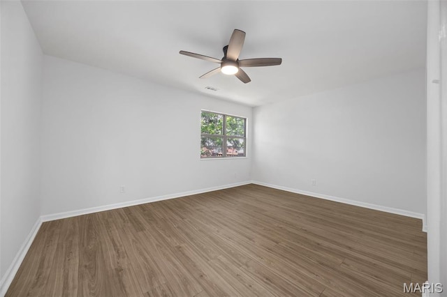8917 Cardinal Ter, Saint Louis, MO 63144 - empty room featuring wood finished floors, ceiling fan, and baseboards