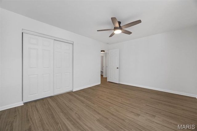 8917 Cardinal Ter, Saint Louis, MO 63144 - unfurnished bedroom with wood finished floors, a closet, baseboards, and a ceiling fan